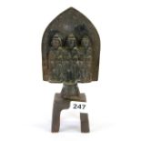 A Chinese cast iron triple deity altar piece, H. 24cm.