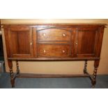 A 1920's oak sideboard, W. 137cm H. 94cm.