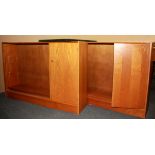 A pair of 1970's Remploy glazed teak bookcase cabinets, size 122 x 29 x 84cm.