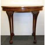 A mahogany ball and claw footed oval side table, W. 91, H. 76cm.
