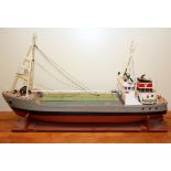 A large motorised wooden model ship, L. 95cm.