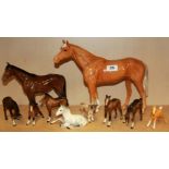A large Beswick porcelain horse figure and nine further Beswick porcelain animals, horse H. 25cm.