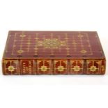 A gilt tooled red leather bound edition of the Essays of Emerson 1908, size 13 x 16 x 3cm.