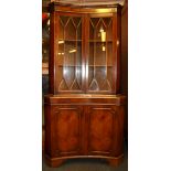 A 1980's Danish hardwood veneered corner drinks cabinet, W. 92 H. 137cm.