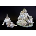 A Lladro porcelain figure of a boy and a girl with a puppy plus a Lladro porcelain figure of a