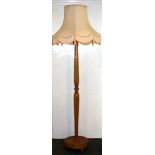 A satinwood standard lamp and shade.