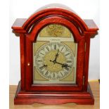 A wooden mantle clock, H. 36cm.