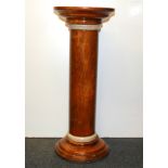 A polished wooden pedestal, H. 70cm.