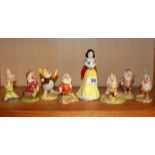 A set of Royal Doulton porcelain Disney figures of Snow White and the seven dwarves, Snow White H.