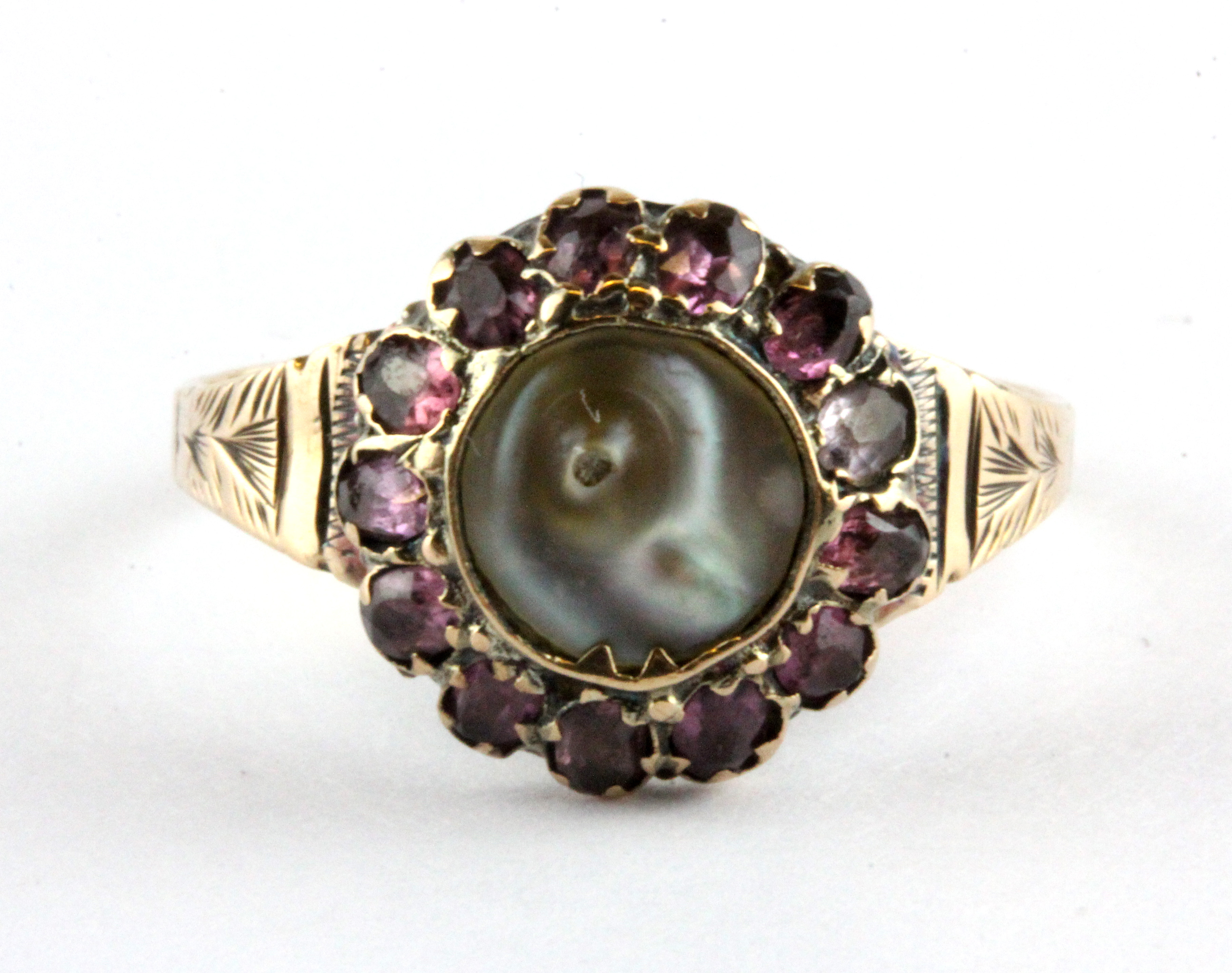 An Edwardian 9ct yellow gold cluster ring set with tourmalines and mother of pearl, c. 1907,