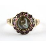 An Edwardian 9ct yellow gold cluster ring set with tourmalines and mother of pearl, c. 1907,