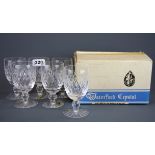 A boxed set of six Waterford crystal claret glasses.