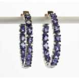 A pair of 925 silver tanzanite set hoop earrings, Dia. 2.6cm.