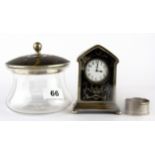 A hallmarked silver and tortoise shell powder bowl, clock and silver napkin ring, tallest H. 12cm.