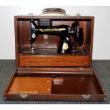 A vintage cased Singer sewing machine.