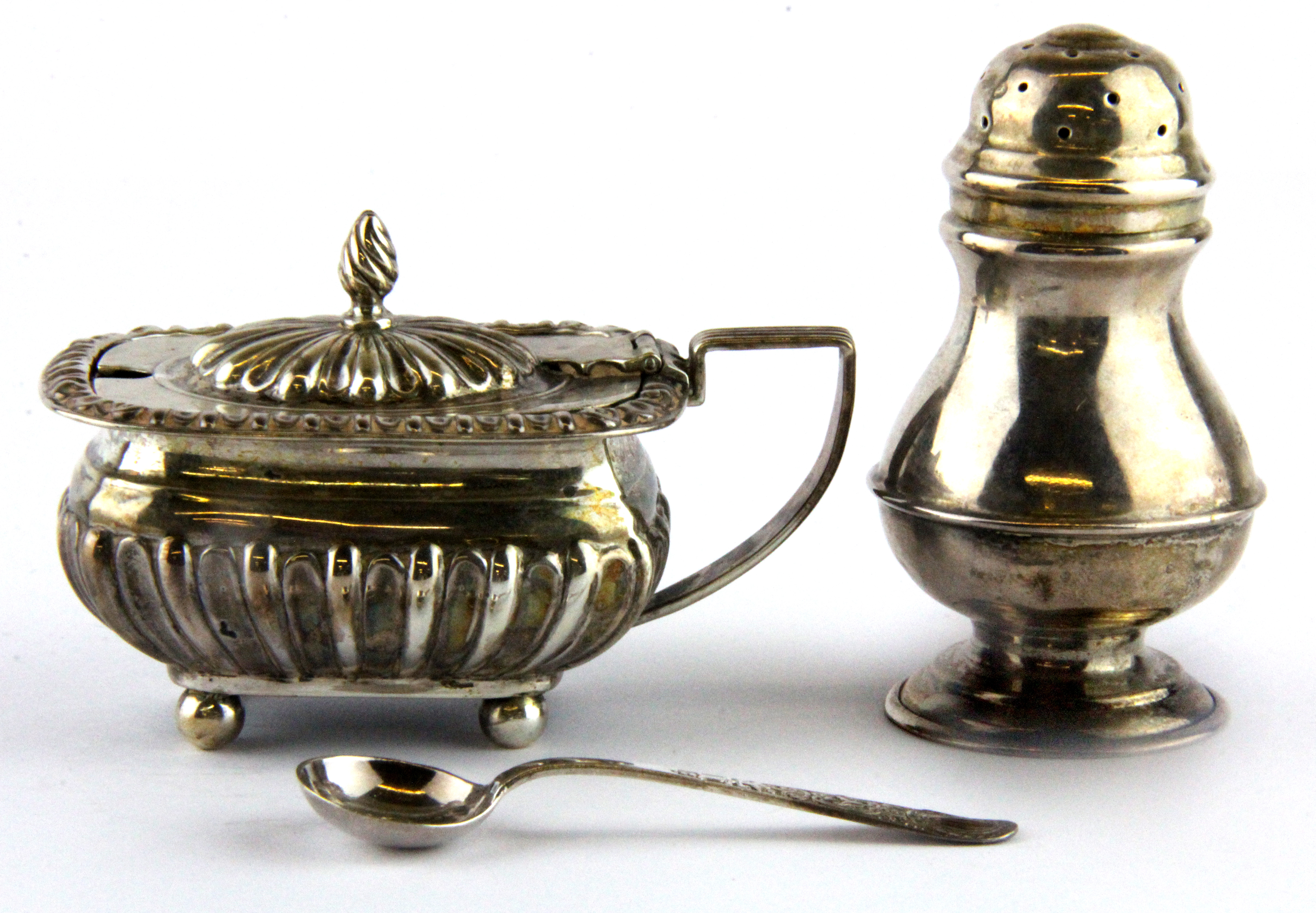 A hallmarked silver mustard pot and pepperette.