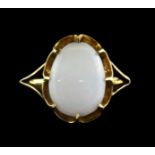 An 18ct yellow gold (stamped 18ct) ring set with a cabochon cut opal (G.5).