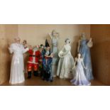A group of seven Royal Doulton porcelain character figurines including 'Sweet Violets' HN 3175