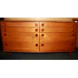 A 1960's light teak eight drawer chest, size 132 x 70cm.