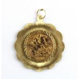 A half sovereign mounted as pendant on 9ct gold, L. 4cm W. 6.9g, c. 1908.