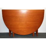 A large G Plan drop leaf teak dining table, W. 108cm.