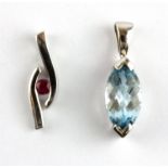 A 9ct yellow gold pendant set with a marquise shaped checker board cut Swiss blue topaz and a