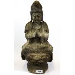 A Chinese carved wooden figure of the goddess Guanyin with remnants of gesso and paint, H. 45cm.