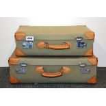 Two leather and canvas cases, largest 46 x 33 x 15cm.