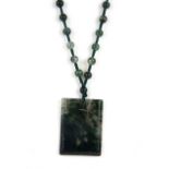 A necklace of moss agate beads and pendant, L. 66cm.
