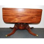A Regency mahogany pedestal drop leaf dining table, folded size 58 x 86cm opening to 116cm.