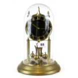 A Kundo anniversary clock under dome, H. 29cm, understood to be in w/o.