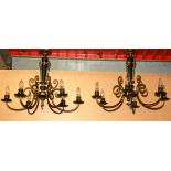 A pair of French gilt and black five branch light fitting, Dia. 66cm D. 56cm.