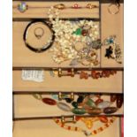 A jewellery case and contents.