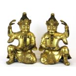 A pair of Tibetan gilt bronze Buddhist guardian figures, H. 25cm.