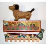 A vintage boxed game and battery operated tin toy.