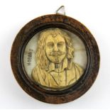 A 19th Century framed carved ivory portrait miniature of a gentleman, Dia. 7cm.