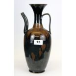 An interesting Chinese Song dynasty style black glazed stoneware wine ewer, H. 31cm.