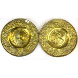 A pair of 18th Century German hammered brass wall plates, Dia. 38cm.