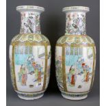 A pair of 19th Century Chinese hand enamelled porcelain vases, H. 43cm. (Both repaired)