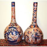 A pair of large 19th Century Japanese Imari bottle vases, H. 61cm.