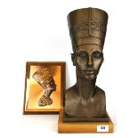A cold cast bust of Nefertiti, H. 42cm, with a copper plaque.