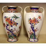 A pair of 1920's Japanese hand painted porcelain vases, H. 32cm.
