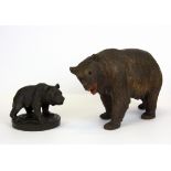 Two carved wooden Black Forest bears, largest H. 12cm L. 22cm.