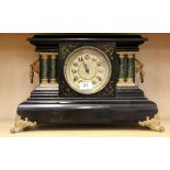 A 19th Century wooden mantle clock, H. 29cm.