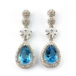 A pair of 925 silver drop earrings set with pear cut Swiss blue topaz and cubic zirconia, L. 3cm.