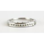 A 9ct white gold gold diamond set half eternity ring, with "I LOVE YOU" pierced on the shank, (N.