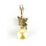 An antique yellow metal (tested 9ct gold) pendant set with a cream pearl and diamonds, L. 4.2cm.