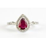 A 925 silver cluster ring set wiith a pear cut ruby and white stones, (P.5).