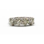 An 18ct white gold (stamped 18k) ring set with four brilliant cut diamonds, approx. 1.2ct