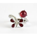 A 925 silver ring set with cabochon and pear cut rubies, (P.5).